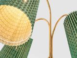 pair of green and gold bamboo lamps with shades on each of them