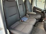 four seats in the back of a van that are empty
