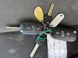 a bunch of keys that are laying on the seat of a car