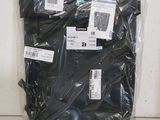 a bag of black clothing sitting on the floor