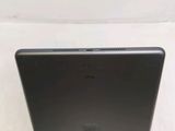 the back of a black laptop computer sitting on top of a white surface