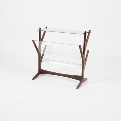 a glass and wood magazine rack on a white background