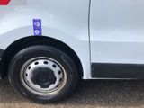 a white van with a blue sticker on the side of it