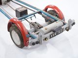 a toy car that is sitting on a white surface