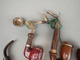 a lot of different types of pipes on the table