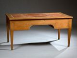 an old wooden desk with a drawer on top of it