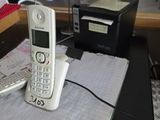 a cell phone sitting on top of a book on a table