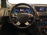 the interior of a car with a steering wheel and dashboard controls