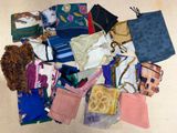 many different types of purses laid out on the floor