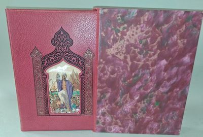 un livre ouvert sur lequel figure une image de Jésus et de Marie