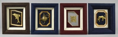 four framed pictures of horses in a row on a wall