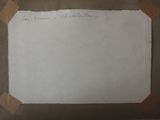 a piece of paper taped to the wall with a piece of tape on it