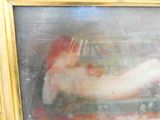 un tableau représentant une femme nue, dans un cadre doré