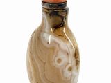 a picture of a glass snuff bottle on a white surface
