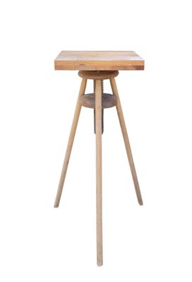 the table is made of wood and has a metal base