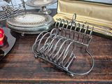 a table with a bunch of silver items on it