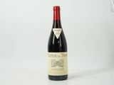 a bottle of wine that is sitting on a table