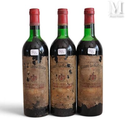 three bottles of wine sitting next to each other on a white surface
