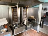 a kitchen with a lot of stainless steel appliances in it