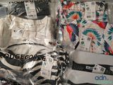 three pairs of underwear wrapped in plastic bags on a table