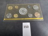 a lot of coins on a table with a price tag