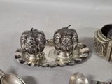 a lot of silver items that are on the table