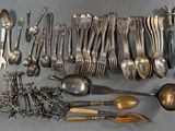 a lot of spoons and spoon spoons on the table