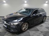 la mercedes cla est garée dans un garage dont le sol est recouvert de carreaux