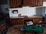 a kitchen with a table and chairs in it