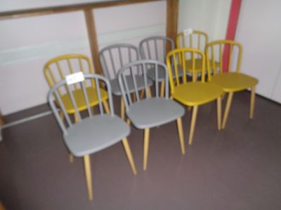 four chairs in a row in a room