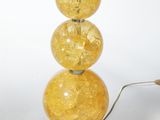 a lamp that has three balls on top of it