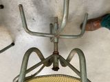a person standing next to a chair that has a handle on it