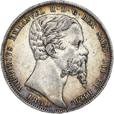 une pièce d'argent représentant le visage d'un homme barbu