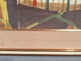 a painting on the wall of a room with a chair and a table