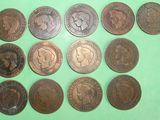 several different types of coins on a green surface