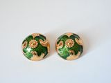 pair of green and gold tone earrings with floral design