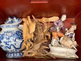 a red box with a bunch of figurines in it