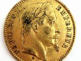 l'image d'une pièce d'or sur laquelle figure le visage d'un homme