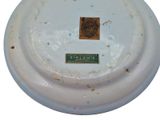a close up of a white plate with a label on it