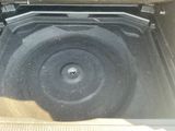 the inside of a car trunk with a speaker in it