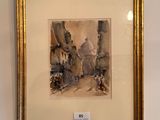 framed watercolor painting of a street scene in a gold frame
