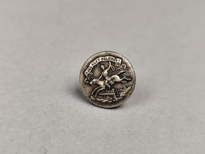 une petite pièce d'argent sur laquelle figurent un cheval et un cavalier
