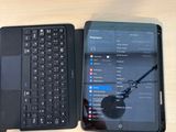 two laptops sitting next to each other on a table