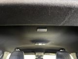 two seats in the back of a car with a remote control