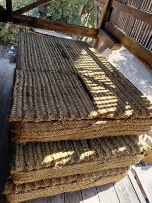 several pieces of rope are stacked on top of each other on a bench