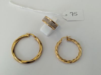 two pairs of gold hoop earrings and a ring