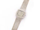 an image of a wrist watch sitting on top of a white surface