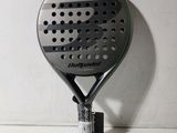 a close up of a tennis racquet on a wall