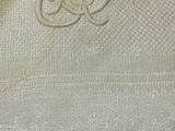 a close up of a piece of cloth with a crown on it
