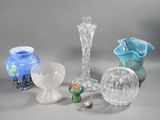 many different glass vases sitting on a table